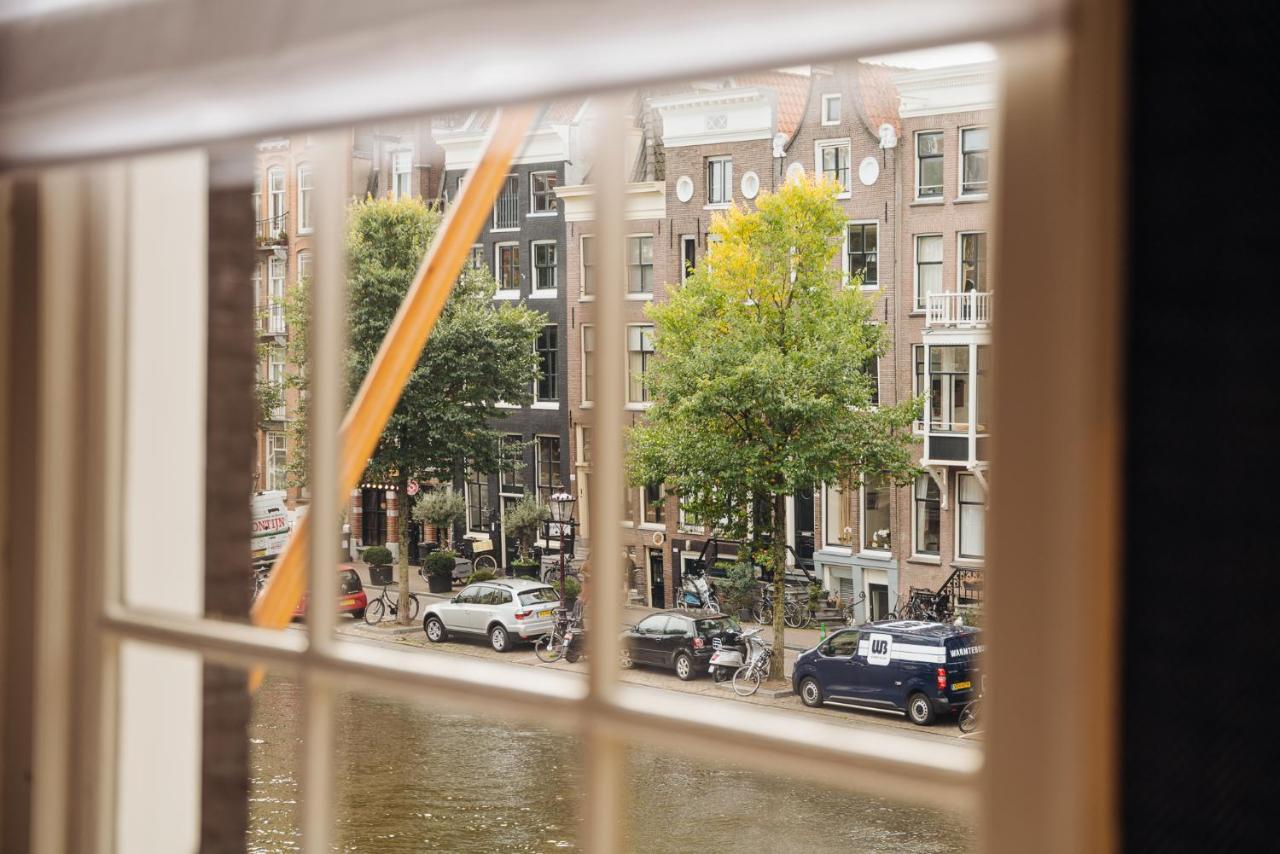 Hotel 717 Amszterdam Kültér fotó View from the window of a canal house in Amsterdam
